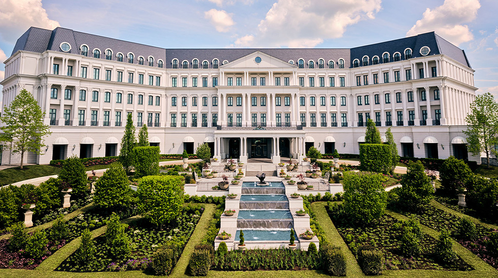 The Chateau at Nemacolin, classical hotel exterior with gardens — ALMAS Hospitality luxury development advisory