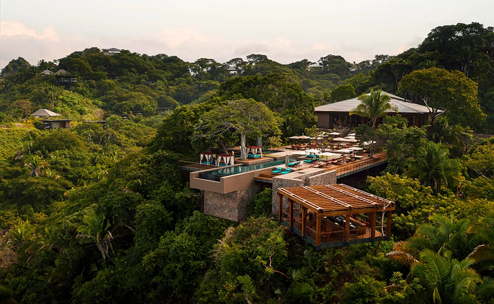One&Only Mandarina, aerial view of the Alma restaurant and canopy-level pool over the jungle, Riviera Nayarit, Mexico — ALMAS Hospitality luxury development advisory