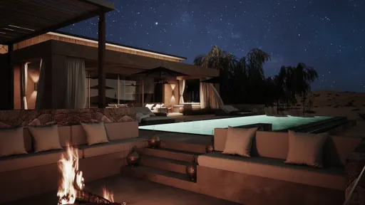 Ritz-Carlton Residences Al Wadi Desert — villa pool at night